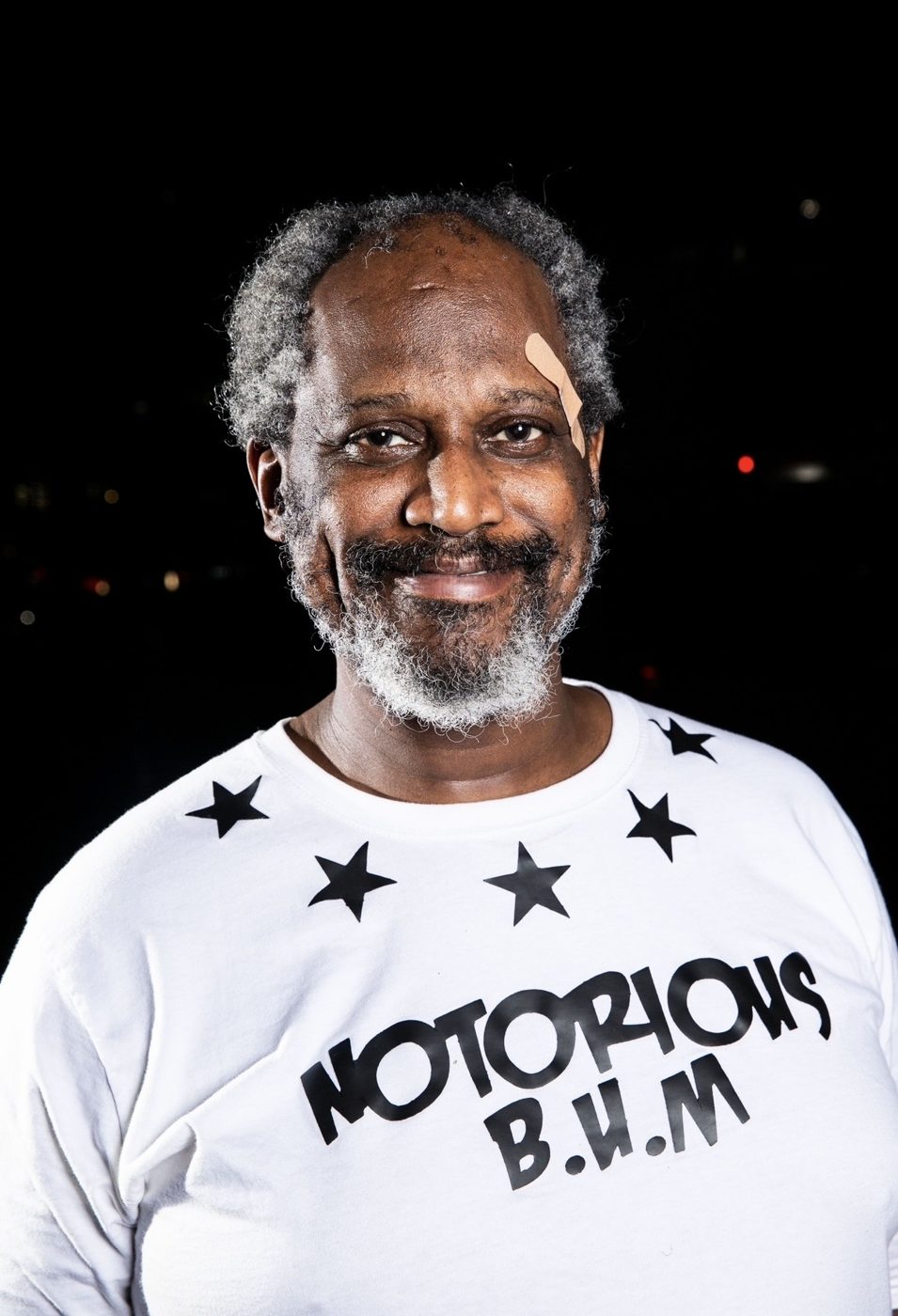 Portrait of a smiling man with a gray beard